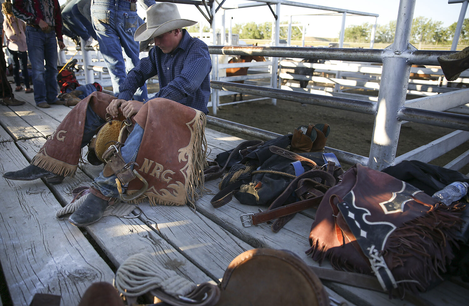 Norris Graves rocks back and forth in his saddle to continue final preparations